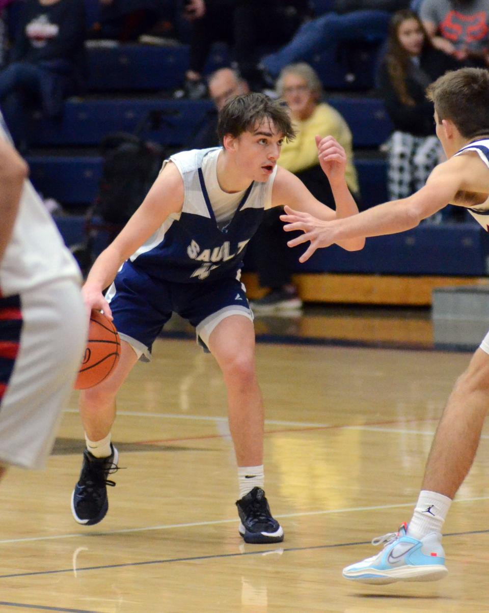 Max Scott and the Sault Blue Devils captured a Straits Area Conference title Friday when they just edged out St. Ignace on the road.