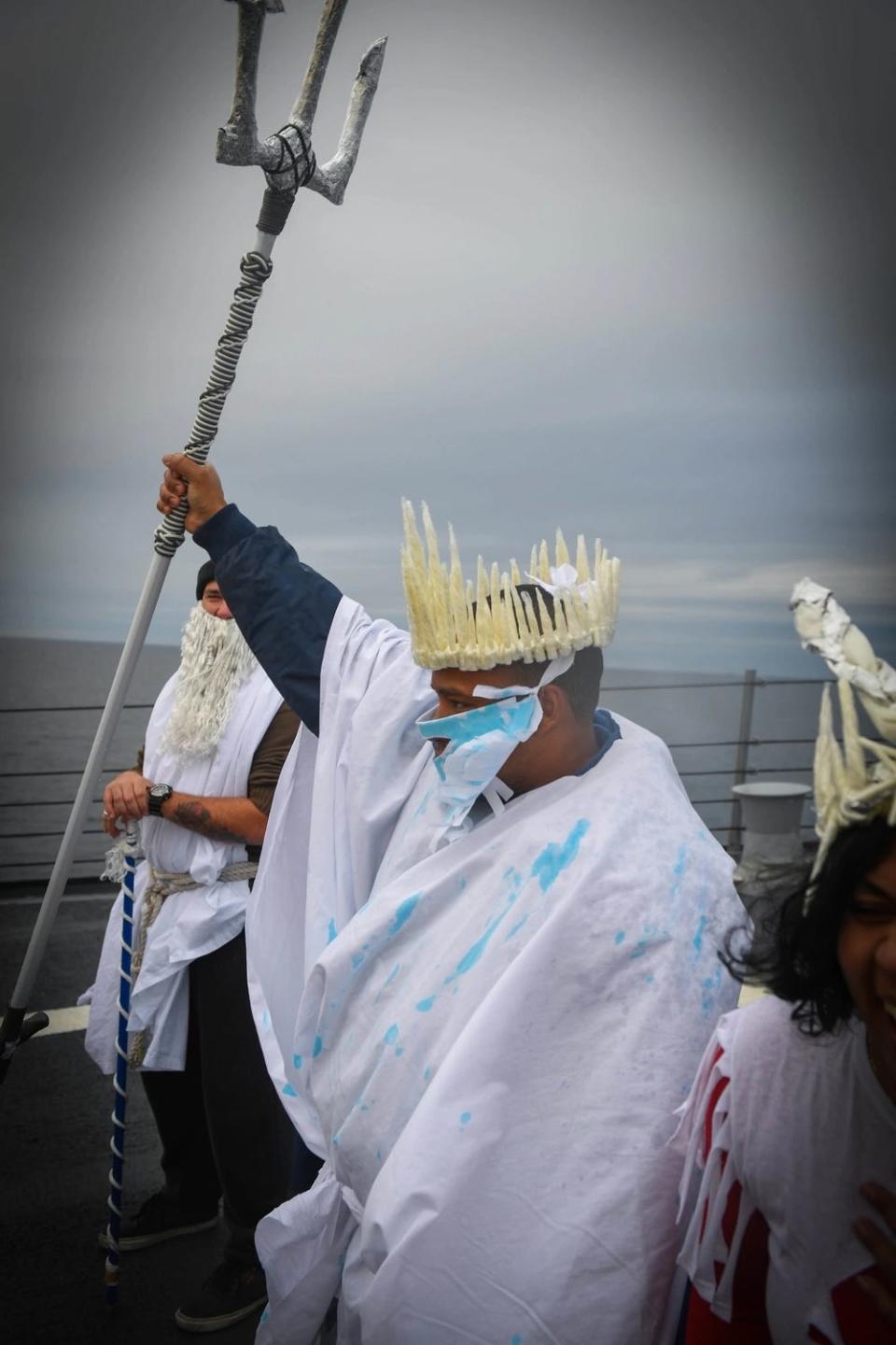 Culinary Specialist Senior Chief Petty Officer Aneuris Robles plays the role of Boreas Rex, the King of the North, and initiates Sailors into the "Order of the Blue Nose"