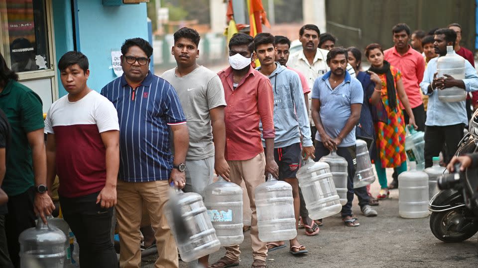 People line up to collect drinking water during the ongoing crisis in Bengaluru on March 14, 2024. - Idress Mohammed/AFP/Getty Images