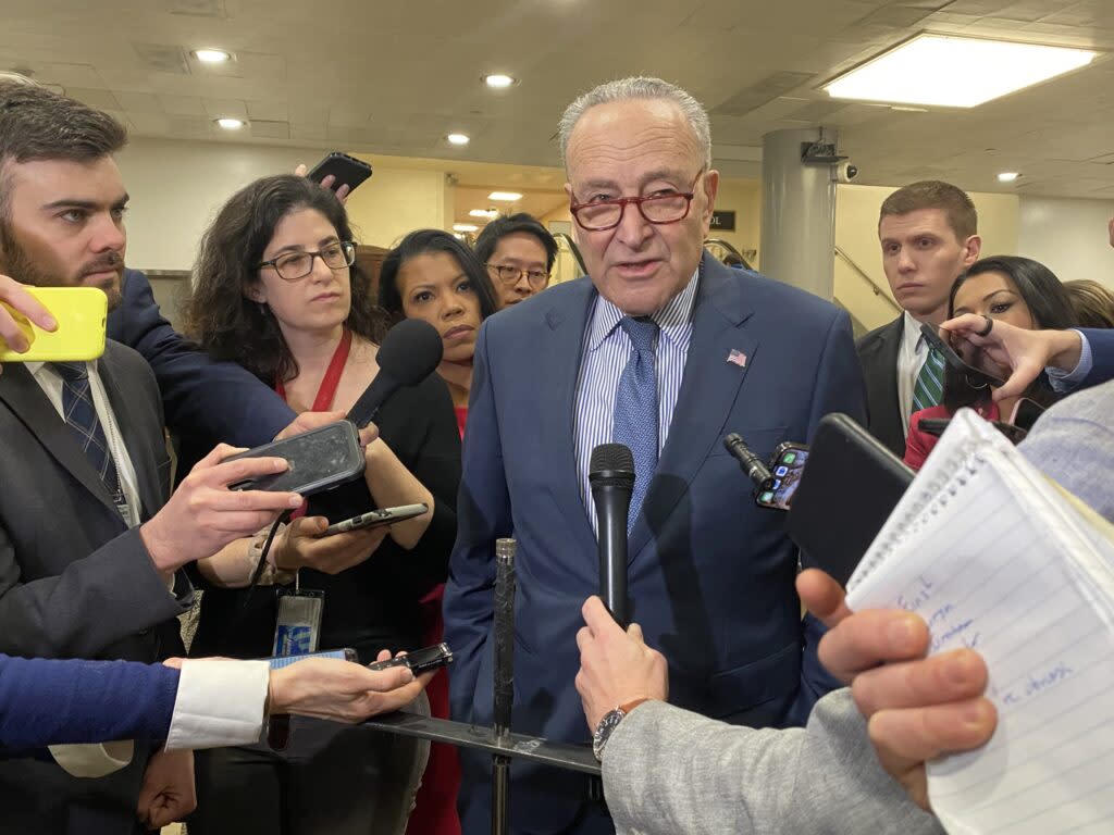 U.S. Sen. Chuck Schumer speaks with reporters in the basement of the U.S. Capitol on Wednesday, Feb. 7, 2024.