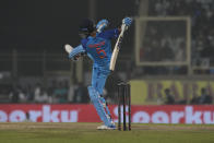 India's Washington Sundar balance himself after playing a shot during the first Twenty20 cricket match between between India and New Zealand in Ranchi, India, Friday, Jan. 27, 2023. (AP Photo/Bikas Das)