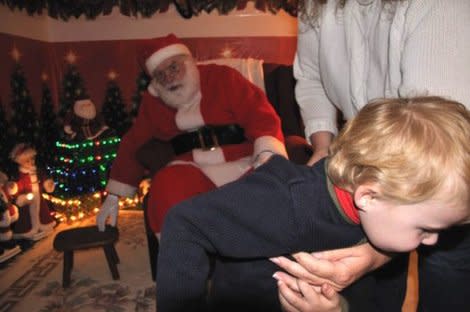 <div class="caption-credit"> Photo by: Lee Crowell</div><p> "My 3-year-old son happily visited Santa without incident the previous two years; there was no reason to believe this year would be different. While waiting his turn Matt bounced with excitement, and upon seeing Santa was wide-eyed and embraced him immediately. Nobody saw it coming. The moment he was asked to sit on Santa's lap, a jolt went through his spine. Matt decided that he had no use for Santa. Matt refused to sit on his lap, or even next to him, and scrambled for the door shrieking "<i>No Santa!</i> <i>No Santa!</i>" We were so surprised that my camera-wielding husband could not avoid being bowled over by his escaping son, while managing to snap one photo to record the disappointing event." - Lee Crowell, <a href="http://voices.yahoo.com/santa-fail-no-santa-no-santa-11920433.html?cat=25" data-ylk="slk:Santa Fail: "No Santa! No Santa!";elm:context_link;itc:0;sec:content-canvas;outcm:mb_qualified_link;_E:mb_qualified_link;ct:story;" class="link  yahoo-link">Santa Fail: "No Santa! No Santa!"</a> </p>