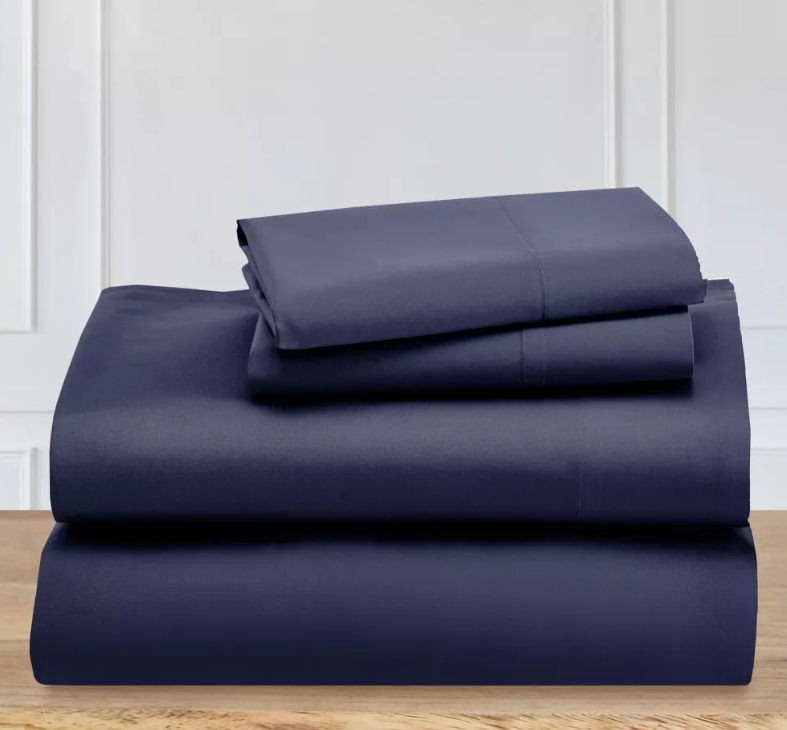 a stack of navy cotton bedding