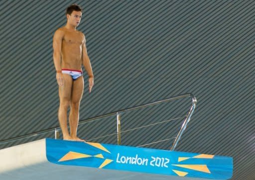 Tom Daley prepares to dive during a practice session at the Aquatics Centre in the Olympic Park last week. Police have arrested a teenager on Tuesday in connection with malicious Twitter messages directed at Tom Daley after the young Olympic diver missed out on a medal