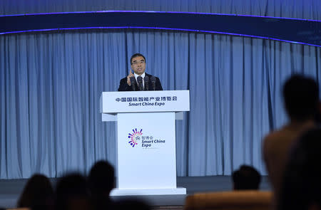 Huawei Technologies Chairman Liang Hua speaks at the first Smart China Expo in Chongqing, China August 23, 2018. Picture taken August 23, 2018. Chen Chao/CNS via REUTERS