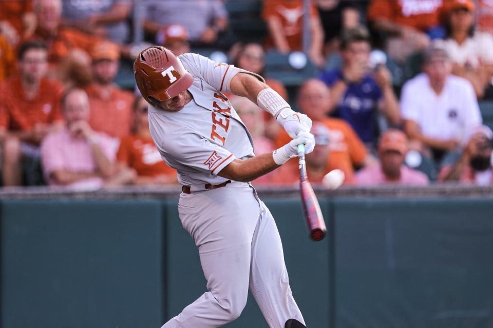 Texas infielder Ivan Melendez (17) hits a ball during the NCAA regional playoff game against Air Force at Disch-Falk Field in Austin, Texas on June 5, 2022.