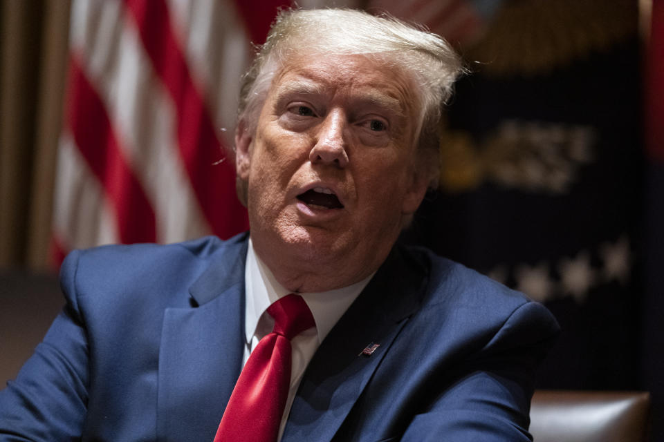 President Donald Trump speaks during a meeting with North Dakota Gov. Doug Burgum and Colorado Gov. Jared Polis on the coronavirus response, in the Cabinet Room of the White House, Wednesday, May 13, 2020, in Washington. (AP Photo/Evan Vucci)