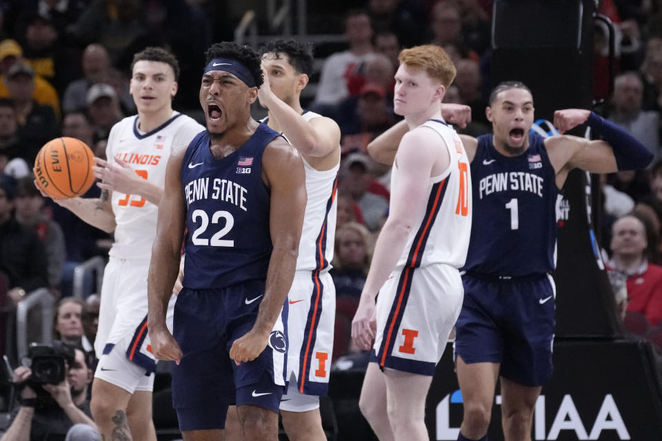 Penn State's Jalen Pickett (22) celebrates after scoring and getting fouled during the second half of an NCAA college basketball game against Illinois at the Big Ten men's tournament, Thursday, March 9, 2023, in Chicago. Penn State won 79-76. (AP Photo/Charles Rex Arbogast)