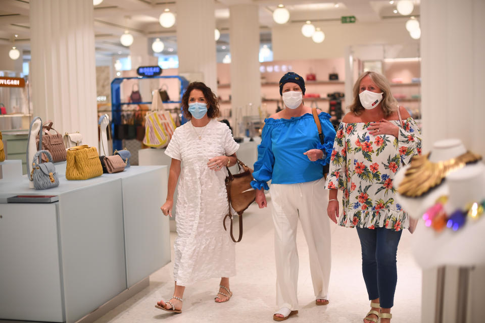 Shoppers wearing a face masks in Selfridges on Oxford Street, London, as face coverings become mandatory in shops and supermarkets in England. (Photo by Victoria Jones/PA Images via Getty Images)