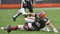 Cleveland Browns quarterback Baker Mayfield (6) fumbles and is injured on a play during the second half of an NFL football game against the Arizona Cardinals, Sunday, Oct. 17, 2021, in Cleveland. (AP Photo/David Richard)