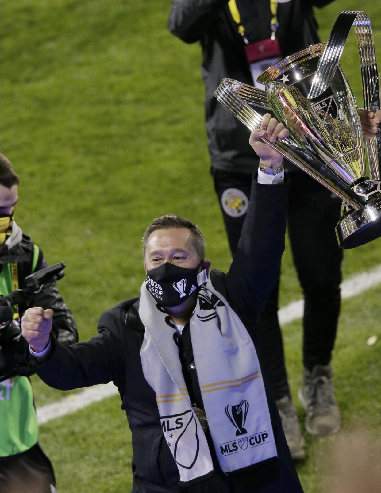 Columbus Crew SC head coach Caleb Porter holds up the Philip F. Anschutz trophy while celebrating a 3-0 win over the Seattle Sounders FC in the MLS Cup championship soccer match at Mapfre Stadium in Columbus, Oh. on Saturday, December 12, 2020.