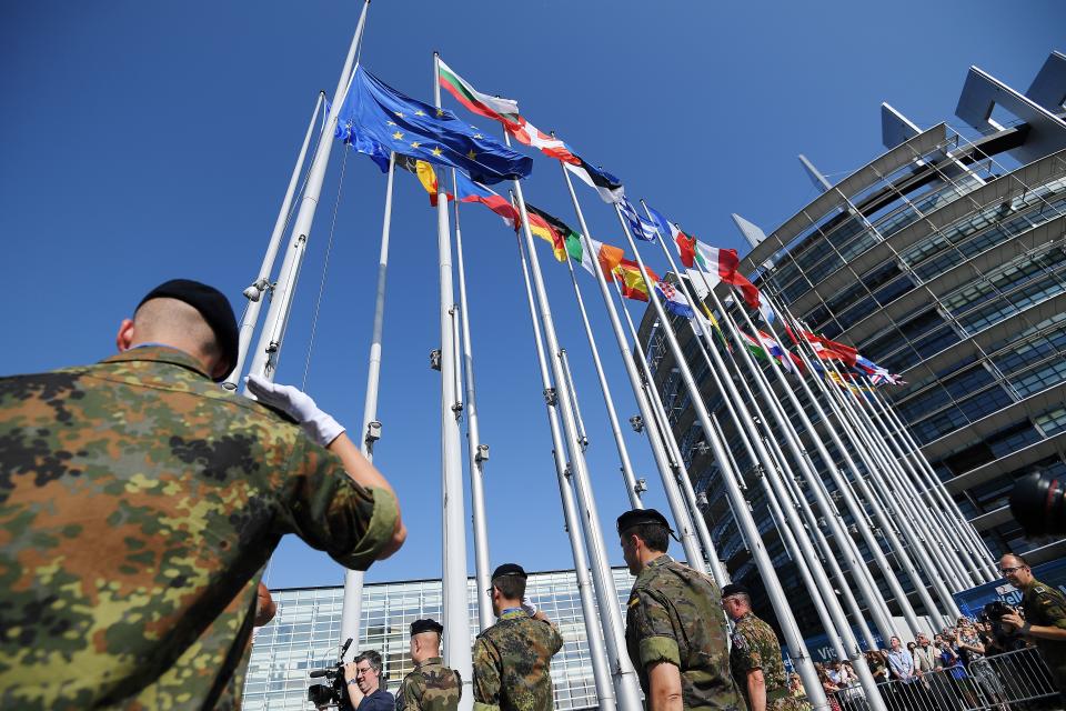 Soldiers of Eurocorps raise an European Union flag during the flag-raising ceremony on the eve of the inaugural session of new European Parliament on July 1, 2019 in front of Louise Weiss building (R), headquarters of the European Parliament in Strasbourg, eastern France. (Photo by FREDERICK FLORIN / AFP)        (Photo credit should read FREDERICK FLORIN/AFP/Getty Images)