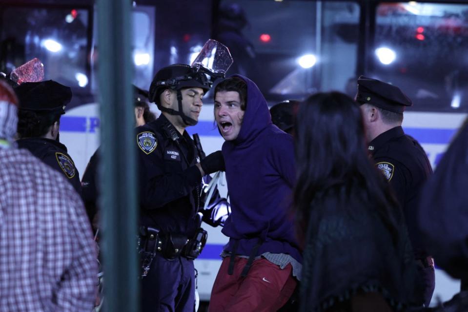 NYPD officers arrested student protesters at Columbia after being given the green light to storm campus. AFP via Getty Images