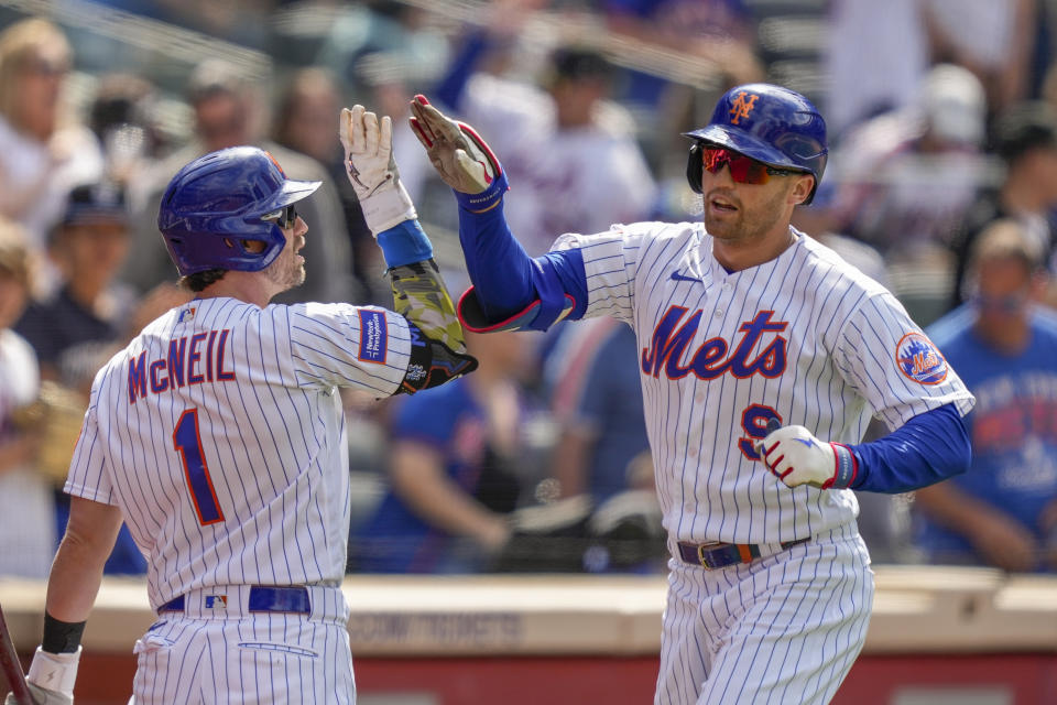 New York Mets' Brandon Nimmo (9) celebrates his solo home run in the seventh inning of the opener of a split doubleheader baseball game against the Cleveland Guardians, Sunday, May 21, 2023, in New York. (AP Photo/John Minchillo)