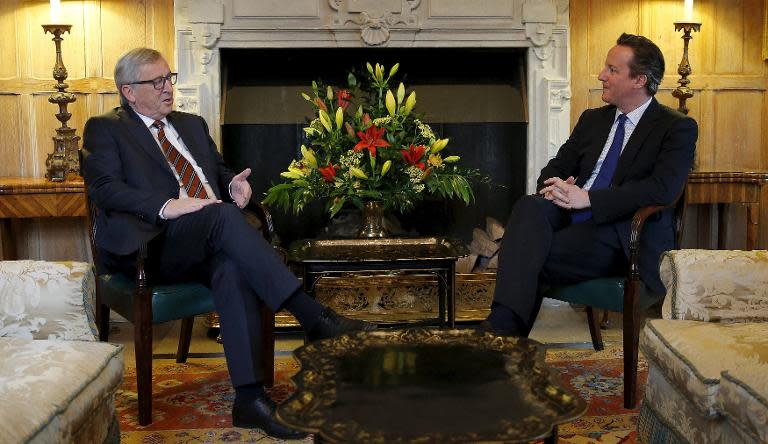 Prime Minister David Cameron (R) and European Commission President Jean-Claude Juncker (L) meet at Chequers, the prime minister's official country residence, on May 25, 2015