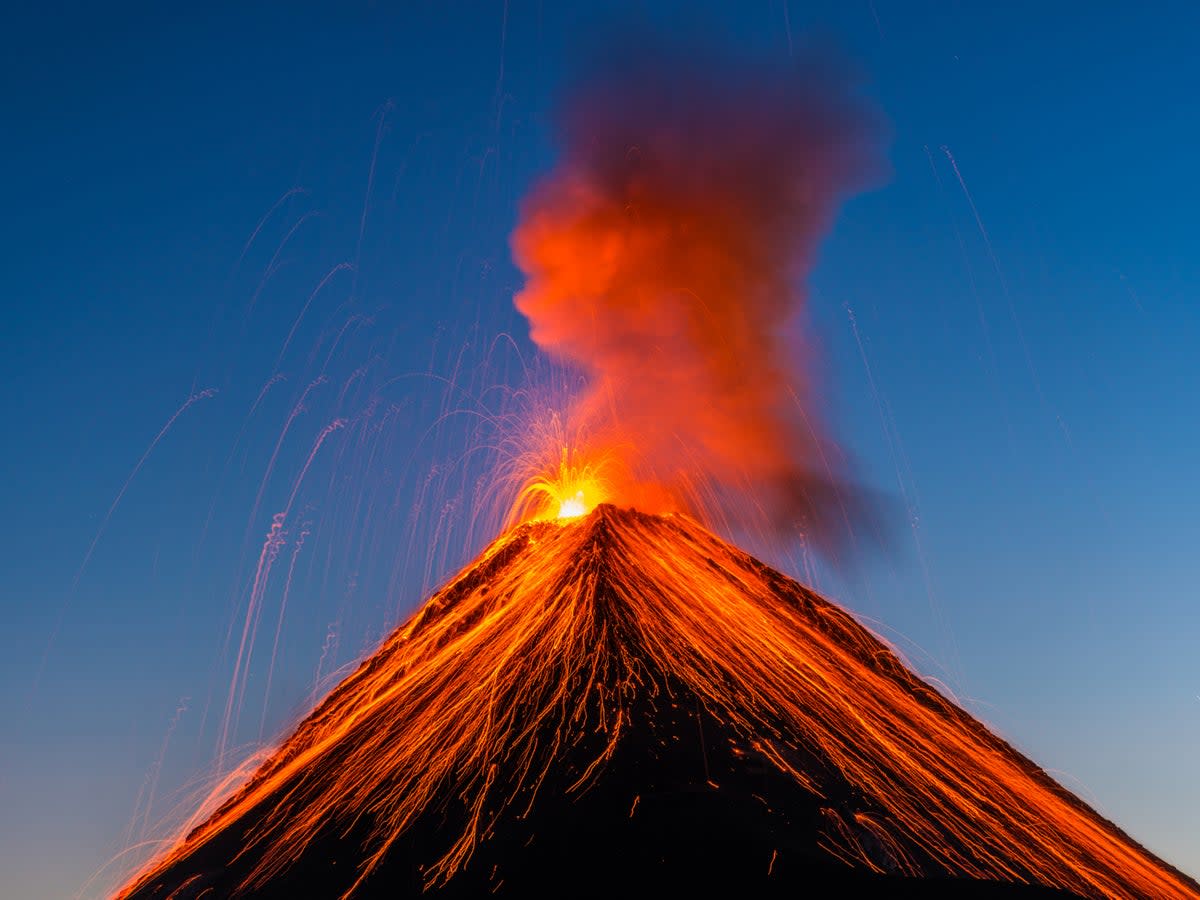 The Fuego volcano in Guatemala erupting in 2016. The impact of huge volcanic eruptions is underestimated, scientists have warned (Getty)