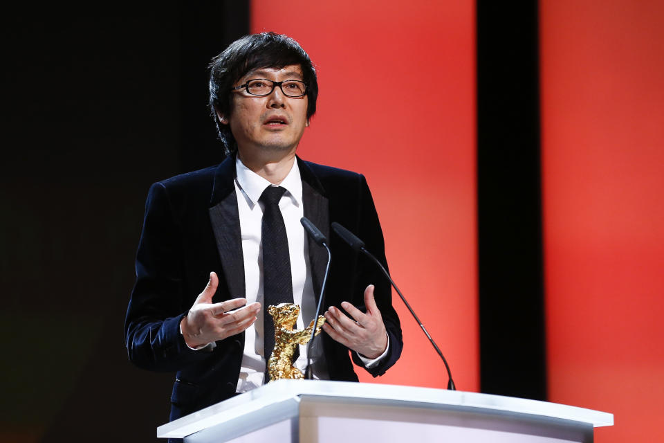 Director Diao Yinan speaks to the audience after receiving the Golden Bear for Best Film for the movie Black Coal, Thin Ice, during the award ceremony at the International Film Festival Berlinale in Berlin, Saturday, Feb. 15, 2014. (AP Photo/Axel Schmidt)