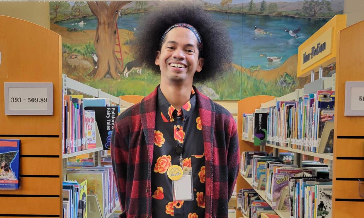 <span>Mychal Threets, former supervising librarian, in the stacks in Fairfield, California, on 14 February 2023.</span><span>Photograph: Diana Ramirez-Simon/The Guardian</span>