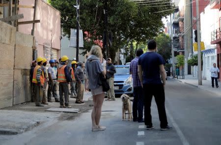 People gather outside after an earthquake was felt in Mexico City, Mexico July 19, 2018. REUTERS/Henry Romero