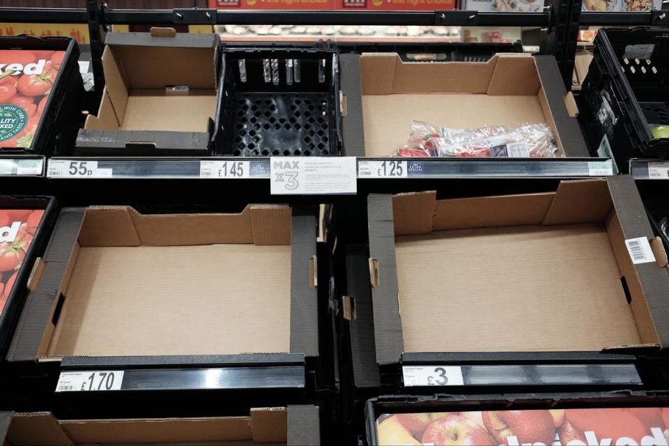 Empty fruit and vegetable shelves at an Asda in east London (Yui Mok / PA Wire)