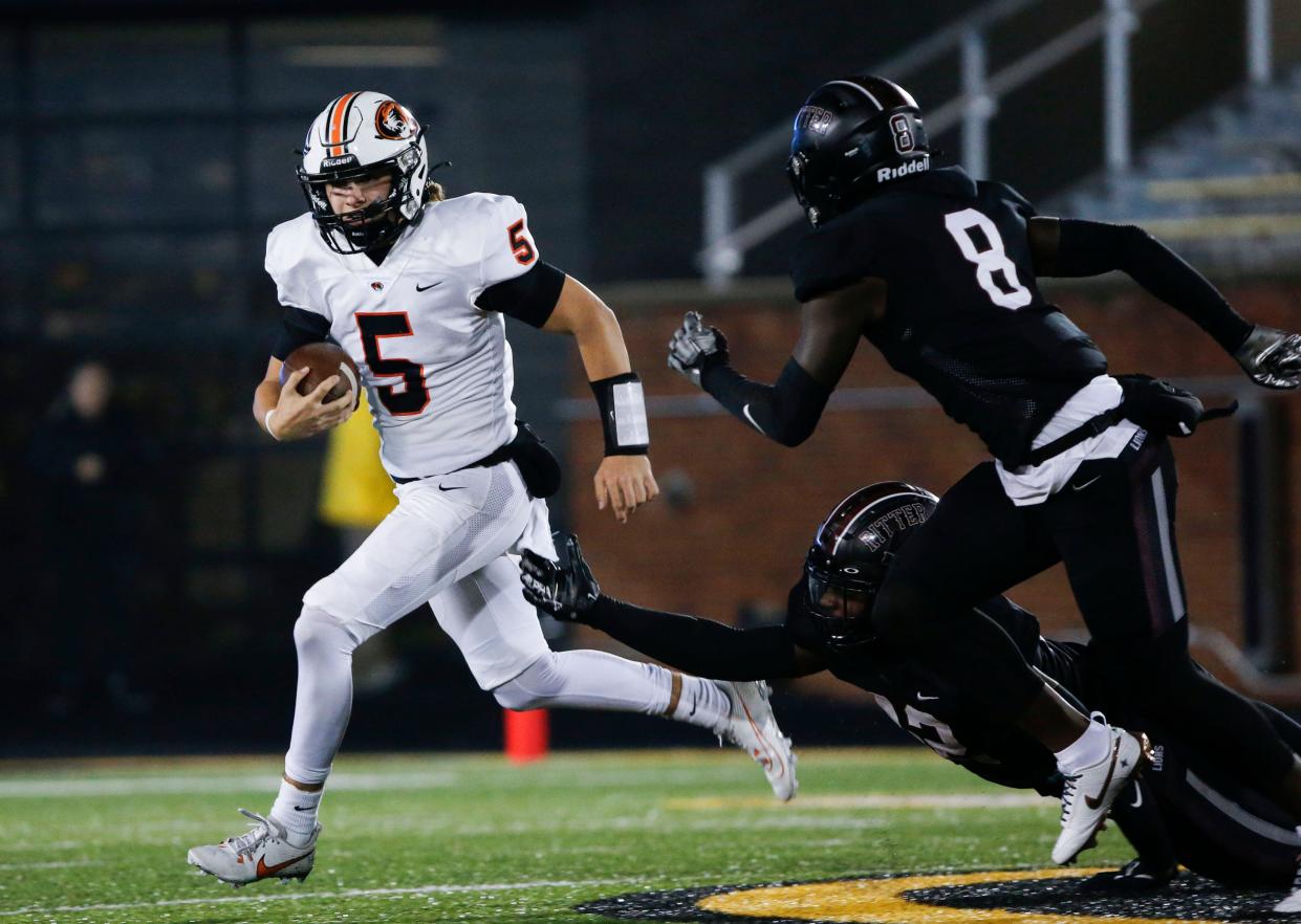 Republic's Wyatt Woods (5) carries the ball as they take on the Cardinal Ritter Lions in the Class 5 State Championship football game at Faurot Field in Columbia, Mo. on Friday, Dec. 1, 2023.