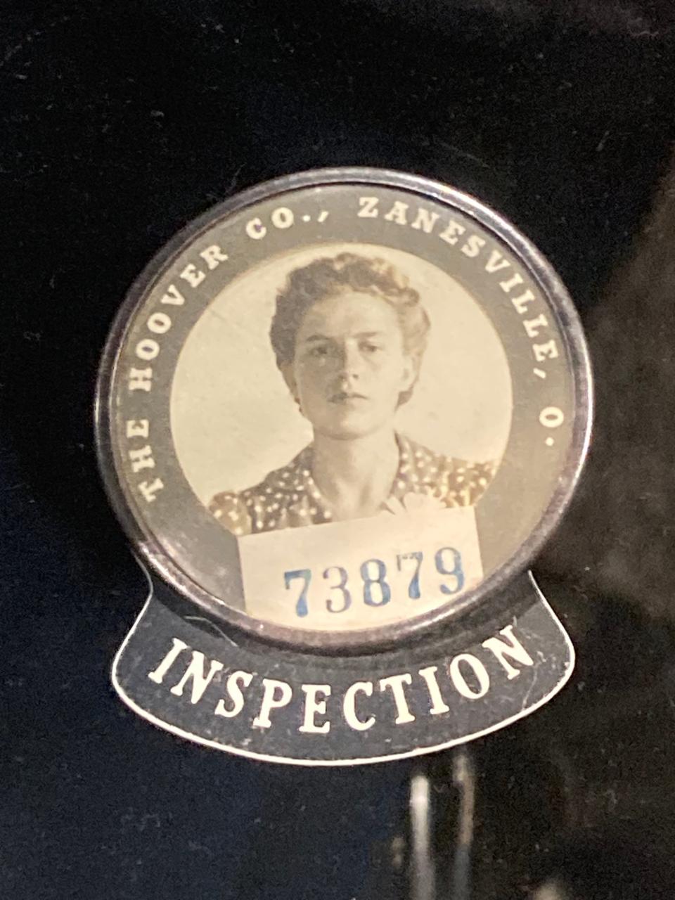 One of the manufacturing jobs women traditionally have held is inspecting materials. This Hoover Company inspector's badge in the Keller Gallery exhibition "Women at Work" is on loan from Hoover Historical Center.