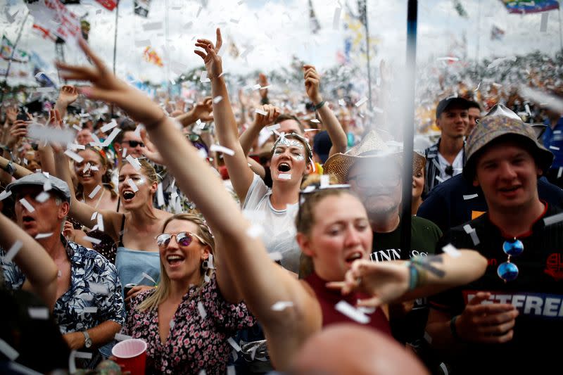 FILE PHOTO: Revellers watch Years & Years performing during Glastonbury Festival in Somerset