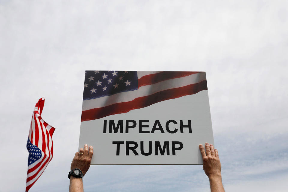 <p>Demonstrators gather near the Washington Monument during the “March for Truth” on June 3, 2017 in Washington, D.C. (Photo: Aaron P. Bernstein/Getty Images) </p>