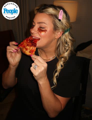 <p>Heather McMahan</p> Heather McMahan eating pizza