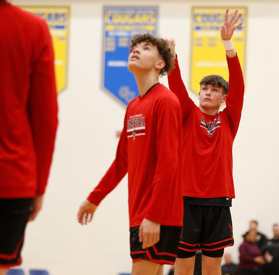 Richmond sophomore Ryder Cate (right) shoots a free throw during warmups before a sectional semifinal game against New Palestine March 4, 2022, at Greenfield-Central High School.