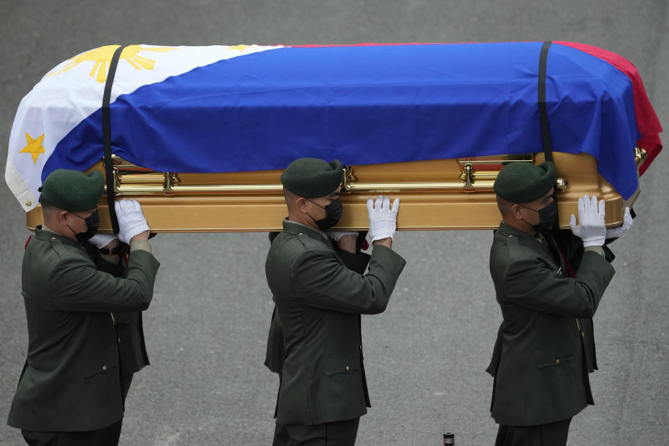 Soldiers carry the flag-draped casket of the late former Philippine President Fidel Ramos during his state funeral at the Heroes' Cemetery in Taguig, Philippines on Tuesday Aug. 9, 2022. Ramos was laid to rest in a state funeral Tuesday, hailed as an ex-general, who backed then helped oust a dictatorship and became a defender of democracy and can-do reformist in his poverty-wracked Asian country. (AP Photo/Aaron Favila)