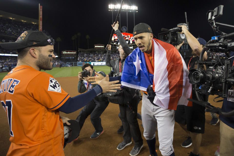 <p>Jose Altuve #27 and Carlos Correa #1 of the Houston Astros celebrate on the field after the Astros defeated the Los Angeles Dodgers in Game 7 of the 2017 World Series at Dodger Stadium on Wednesday, November 1, 2017 in Los Angeles, California. (Photo by Rob Tringali/MLB Photos via Getty Images) </p>