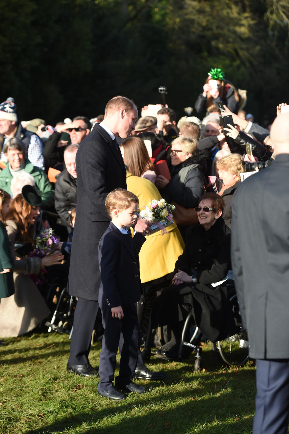 The Duke of Cambridge and Prince George meet well wishers after attending the Christmas Day morning church service at St Mary Magdalene Church in Sandringham, Norfolk.