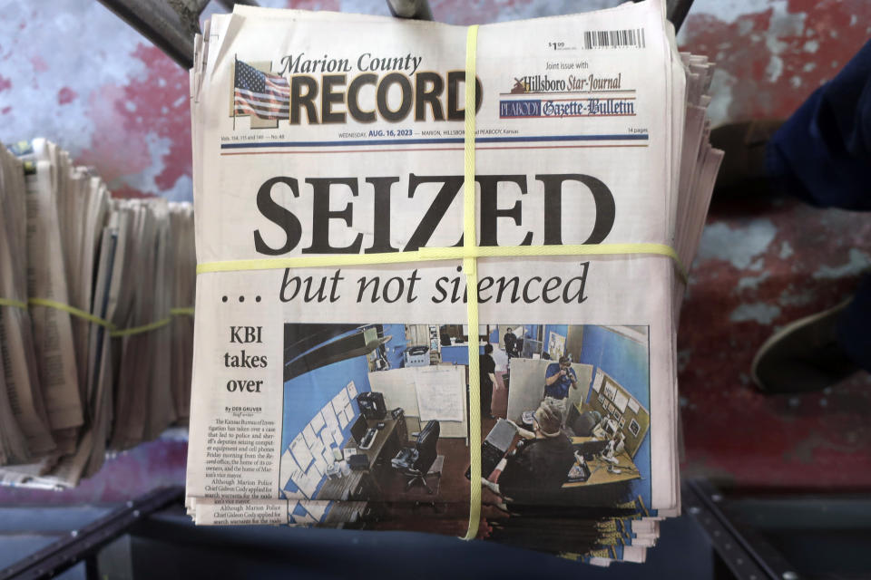 FILE - A stack of the latest weekly edition of the Marion County Record sits in the back of the newspaper's building, awaiting unbundling, sorting and distribution, Wednesday, Aug. 16, 2023, in Marion, Kan. The newspaper's front page was dedicated to two stories about a raid by local police on its offices and the publisher's home on Aug. 11, 2023. (AP Photo/John Hanna)