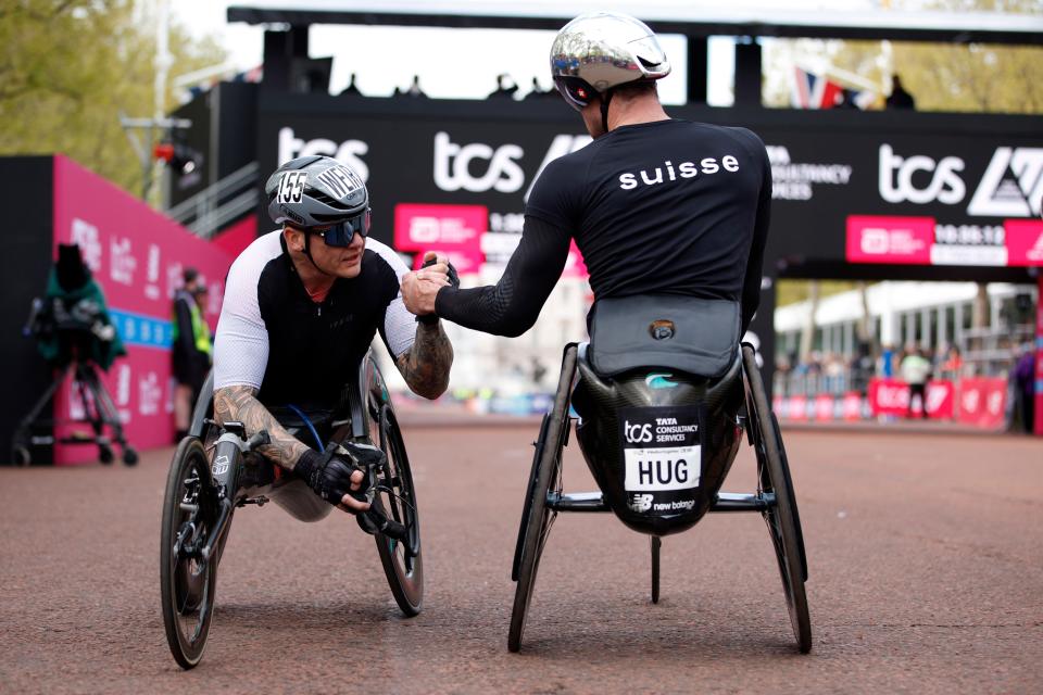 David Weir congratulates winner Marcel Hug (AP)