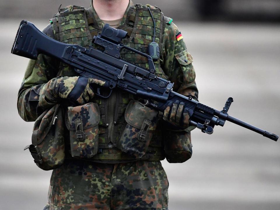 A German soldier holds a machine gun MG4 during the 'Land Operations' military exercises during a media day at the Bundeswehr training grounds on October 14, 2016 near Bergen, Germany. The exercises are taking place from October 4-14. (Getty Images)