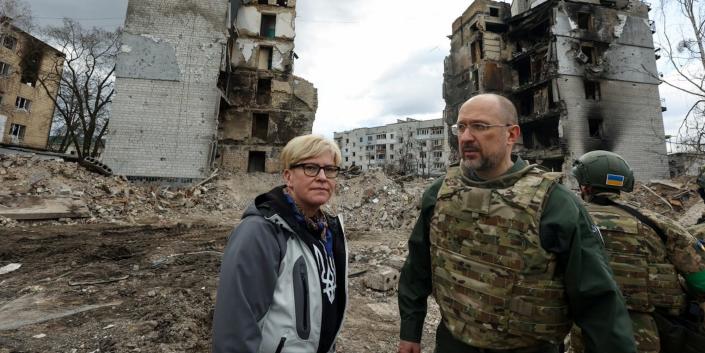 Lithuanian Prime Minister Ingrida Simonyte and Ukrainian counterpart Denys Shmyhal visit the town of Borodianka in Ukraine's Kyiv region in April 2022.