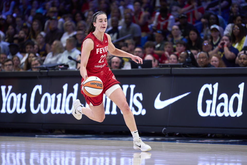 ARLINGTON, TEXAS - JULY 17: Caitlin Clark #22 of the Indiana Fever brings the ball up court against the Dallas Wings at the College Park Center on July 17, 2024 in Arlington, Texas. NOTE TO USER: User expressly acknowledges and agrees that, by downloading and or using this photograph, User is consenting to the terms and conditions of the Getty Images License Agreement.  (Photo by Cooper Neill/Getty Images)