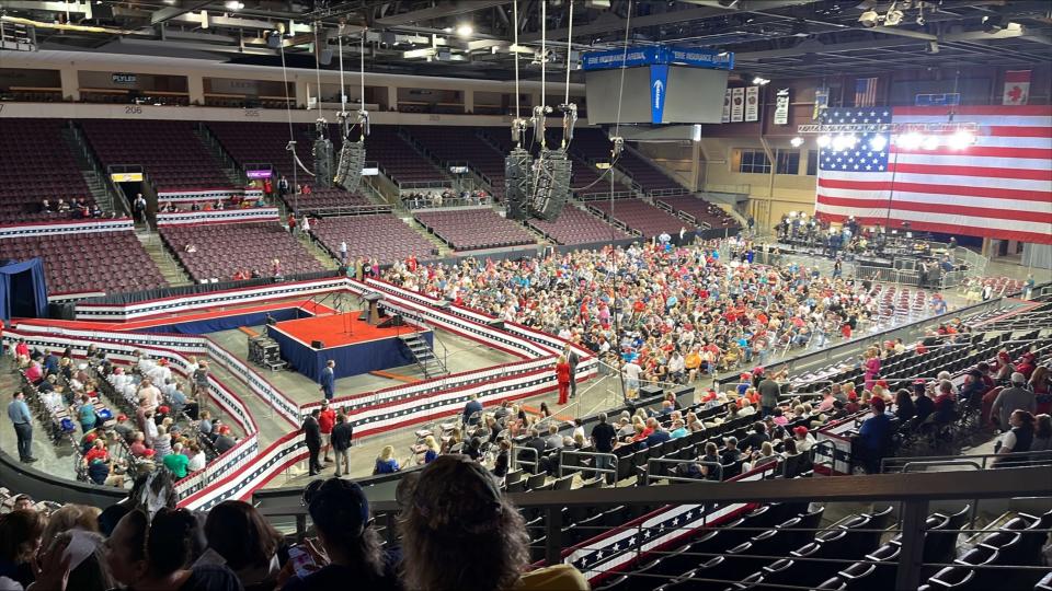 Spectators are shown filing in to the Erie Insurance Arena to attend a Donald Trump rally on July 29, 2023.
