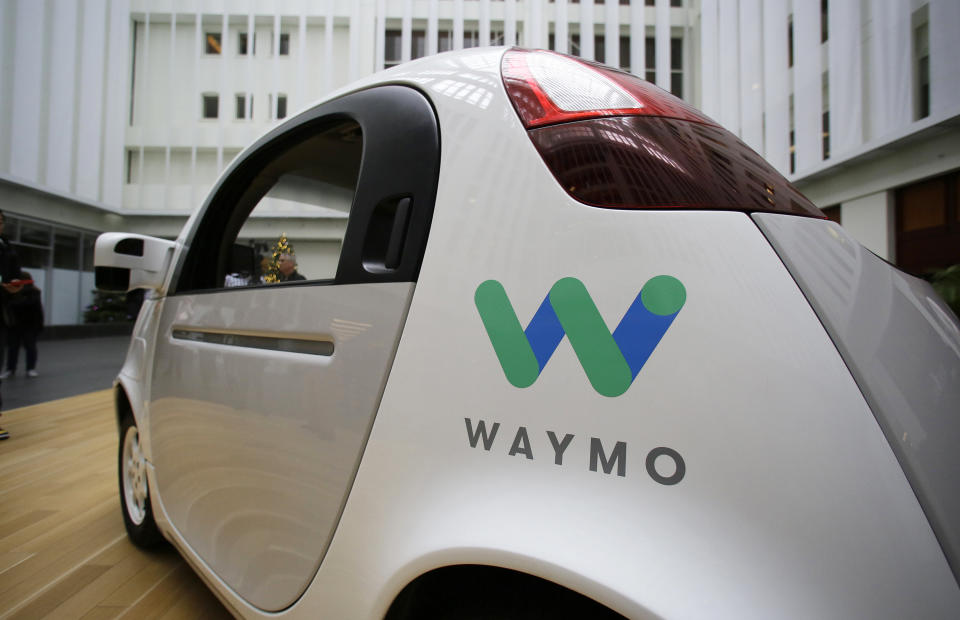 FILE - In this Tuesday, Dec. 13, 2016, file photo, the Waymo driverless car is displayed during a Google event, in San Francisco. Waymo, the self-driving car company owned by Google's parent Alphabet Inc., and Lyft Inc. are teaming up to road test autonomous cars in a potential challenge to Uber Technologies Inc. (AP Photo/Eric Risberg, File)