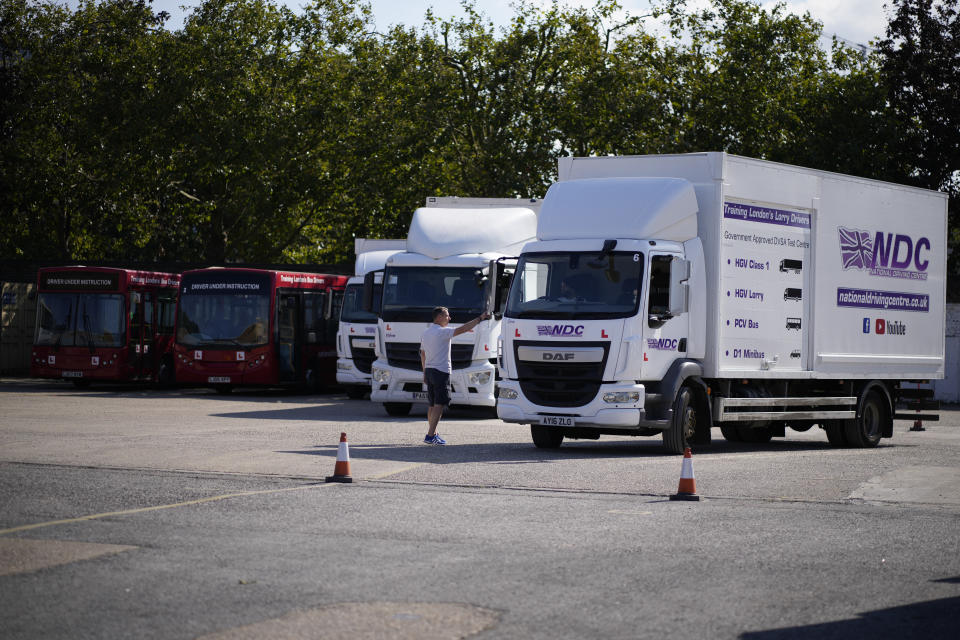 An instructor directs a learner truck driver at the National Driving Centre in Croydon, south London, Wednesday, Sept. 22, 2021. Britain doesn't have enough truck drivers. The shortage is contributing to scarcity of everything from McDonald's milkshakes to supermarket produce. (AP Photo/Matt Dunham)