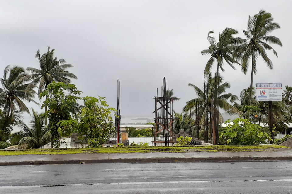 The sky is clouded over in the distance as intermittent rain and wind continue at Suva Harbour in Suva, Fiji, Friday, Dec. 18, 2020. Dozens of homes have been destroyed by a cyclone Yasa which hit the island nation overnight.(AP Photo/Aileen Torres-Bennett)