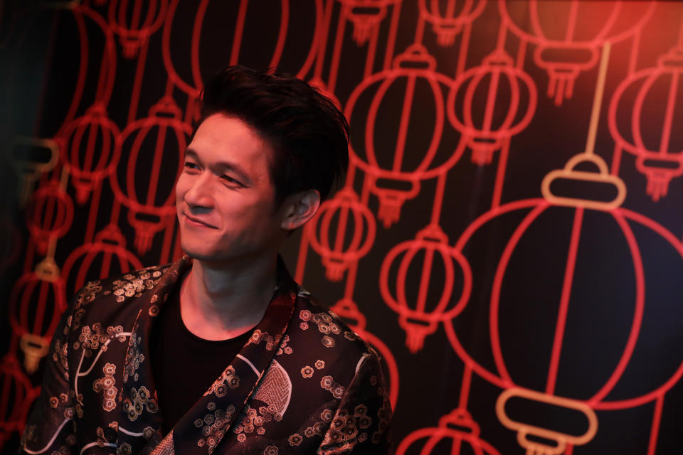 CORRECTS CITY TO LOS ANGELES - Actor Harry Shum Jr. poses for photographs during the opening of a Lunar New Year installation Thursday, Jan. 31, 2019 in Los Angeles. Chinese fast-food chain Panda Express funded the New Year's-themed interactive exhibit inside the Westfield Century City mall. (AP Photo/Marcio Jose Sanchez)