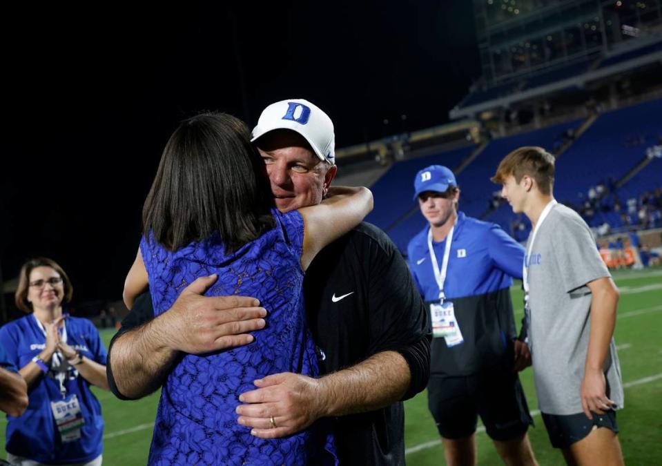 Duke head coach Mike Elko is congratulated by Duke Athletic Director Nina King following the Blue Devils 30-0 victory over Temple at Wallace Wade Stadium on Friday, Sept. 2, 2022, in Durham, N.C.