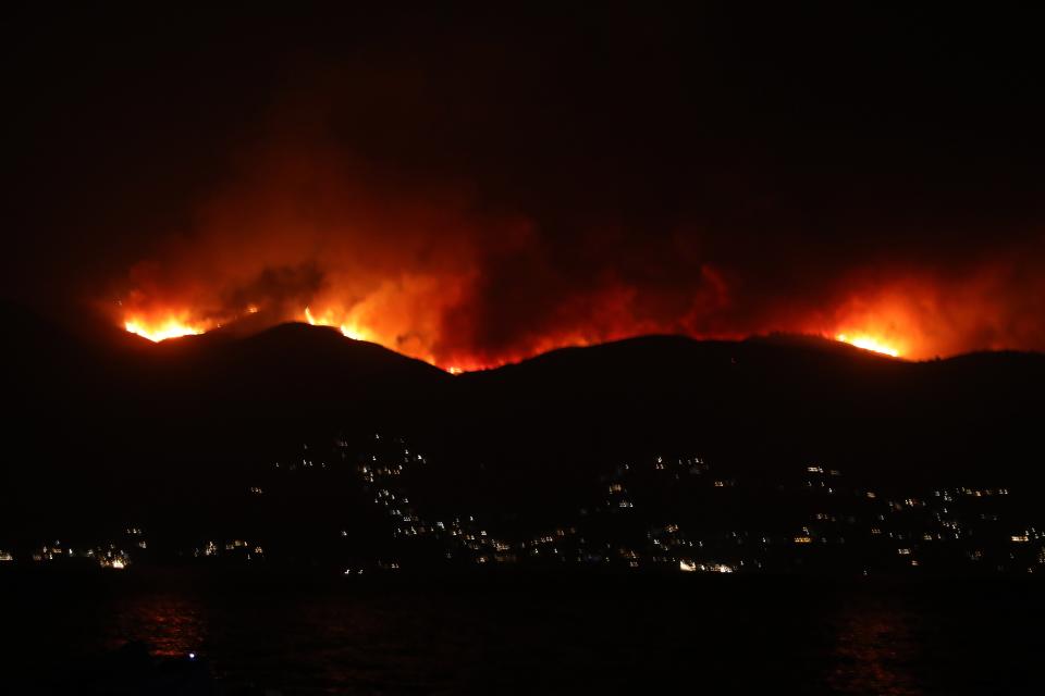 A general view of a wildfire burning on the Pantokratoras  mountain on Corfu island, Greece (EPA)