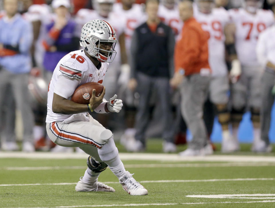 Ohio State quarterback J.T. Barrett runs with the ball during the second half of the Big Ten championship NCAA college football game against Ohio State, Saturday, Dec. 2, 2017, in Indianapolis. (AP Photo/AJ Mast)