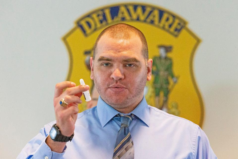 Brent Waninger, a director within the Division of Substance Abuse and Mental Health, shows a Narcan spray at a Delaware Drug Overdose Community Briefing and Response Meeting held at Delaware State Police Troop 2 in Newark, Del., Wed., Jan. 18, 2023. Narcan can save lives by reversing the effects of an opioid overdose.