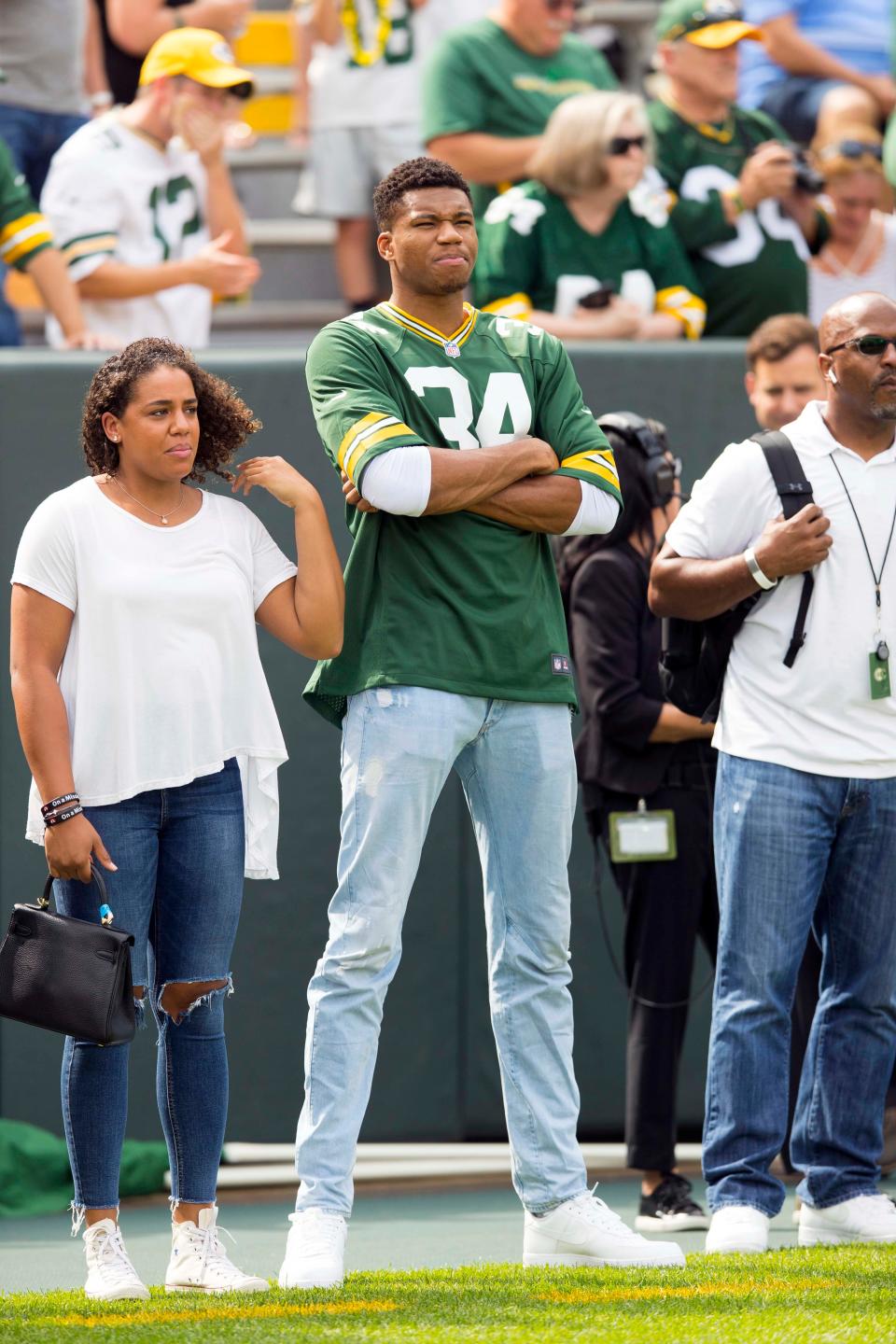 Bucks star Giannis Antetokounmpo took in his first Packers game in 2018. The Bucks' game against the Sacramento Kings has been moved up to 6 p.m. to avoid a direct conflict with the Packers' playoff game against the 49ers, which begins at 7:15 p.m.