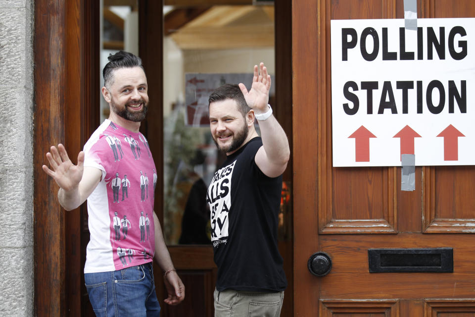 Partners Adrian, left and Shane, arrive to vote at a polling station in Drogheda, Ireland, Friday, May 22, 2015. Same-sex marriage is now legal in 28 countries worldwide, including most of Western Europe, as well as the self-governing island of Taiwan. Legalization came in various ways: through court rulings, legislation and – in the case of Ireland – a resounding endorsement by voters in a 2015 national referendum. (AP Photo/Peter Morrison)