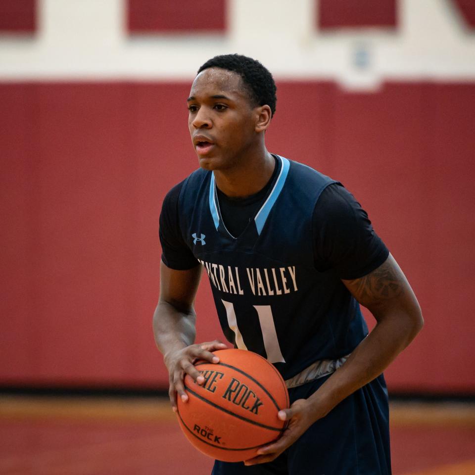 Central Valley Academy's Jaylon O'Neal holds onto the ball at Clinton Senior High School in Clinton on Saturday, February 4, 2023.